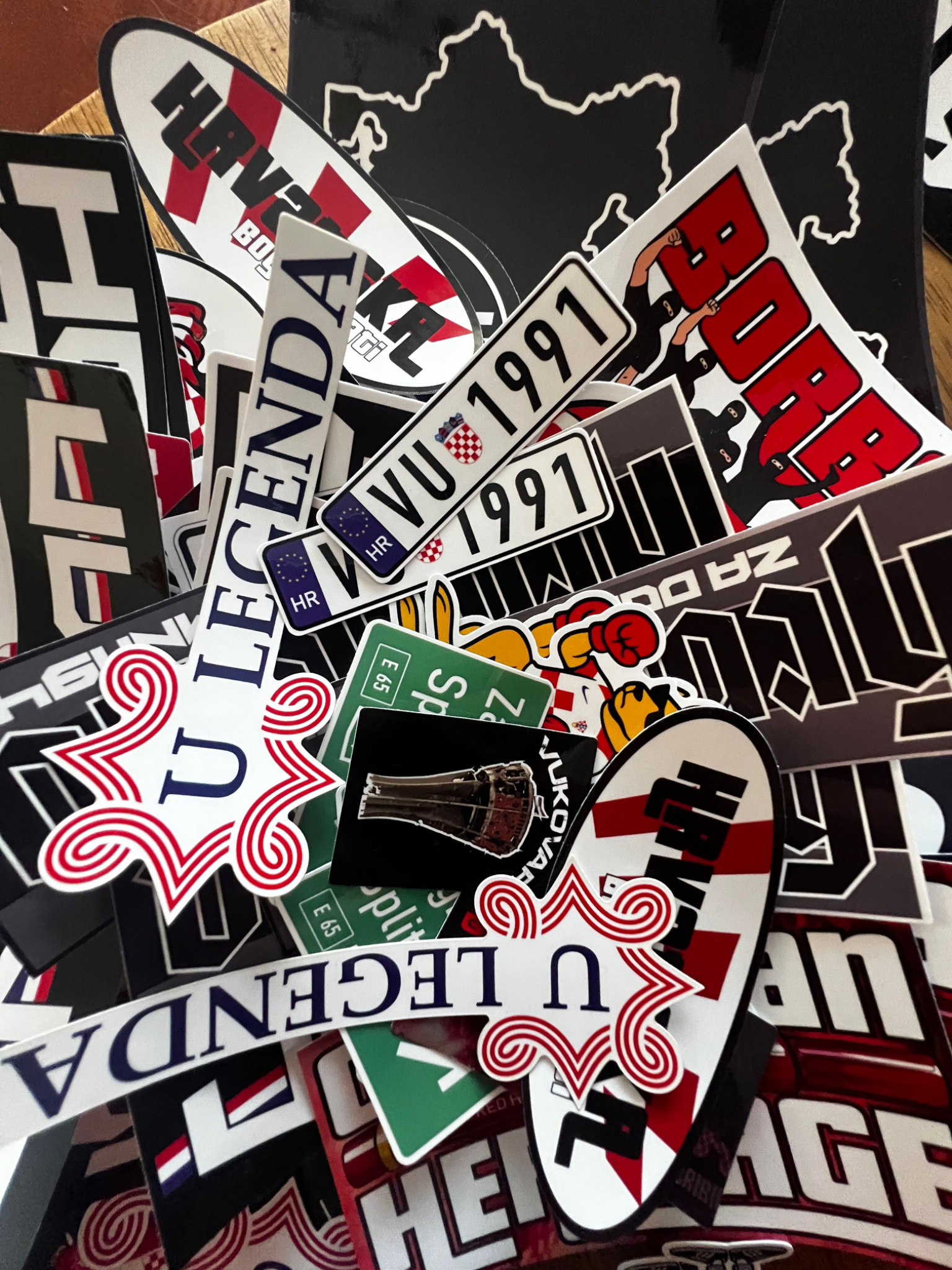 An overlapping collection of printed PONAV stickers on a desk