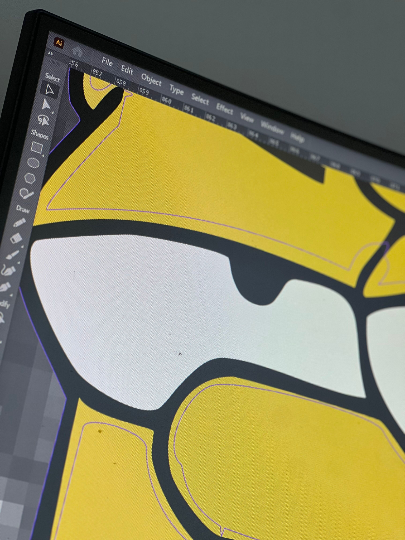 Close-up of yellow character artwork and its editable outlines in Illustrator